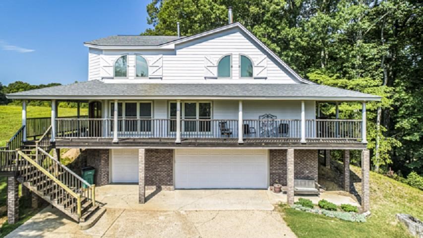 3155 Bass Road Millington, TN 38053 - Photo 2 of 25 Drive under 4 car garage with workshop, safe room. Main level wrap around porch with beautiful views of the property.