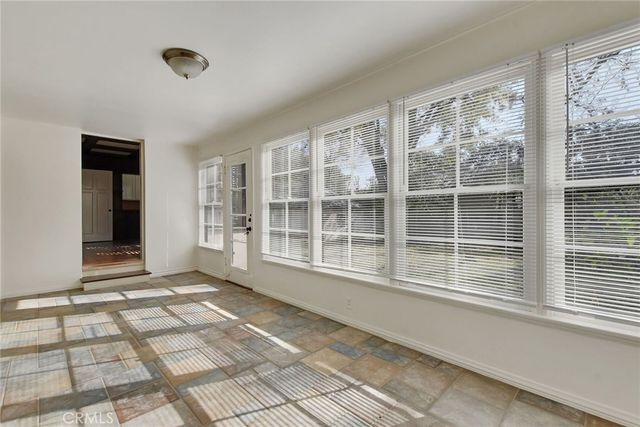 a view of empty room with windows