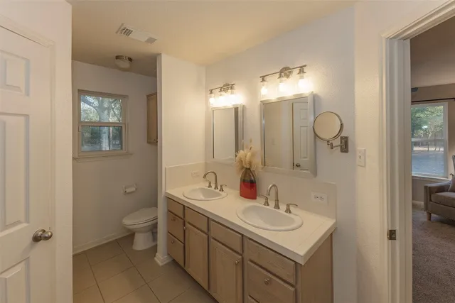 a bathroom with a shower and a glass door