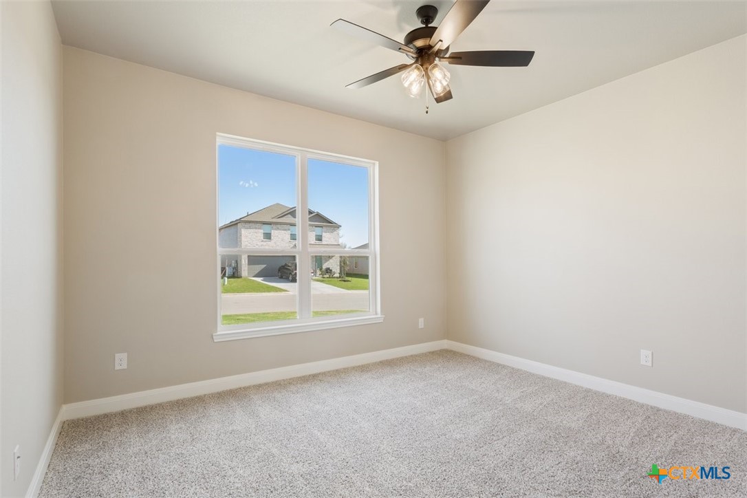 3824 Keller Road Temple, TX 76504 - Photo 20 of 28 an empty room with window and ceiling fan
