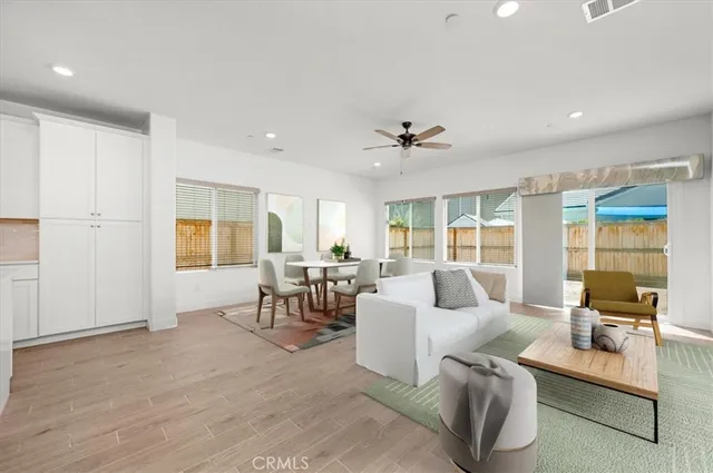 a view of a kitchen with a sink and a refrigerator