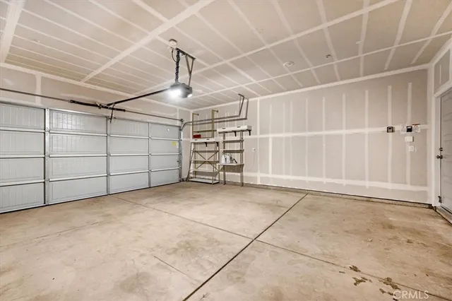 a bathroom with a double vanity sink toilet mirror and a shower