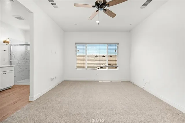 a bathroom with a double vanity sink and mirror