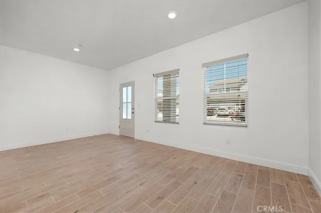 a view of kitchen with furniture and wooden floor