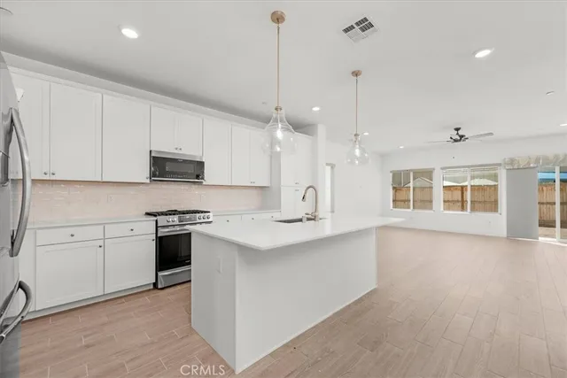 a large kitchen with cabinets