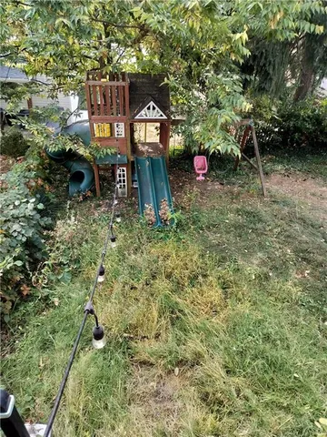 a backyard of a house with lots of green space