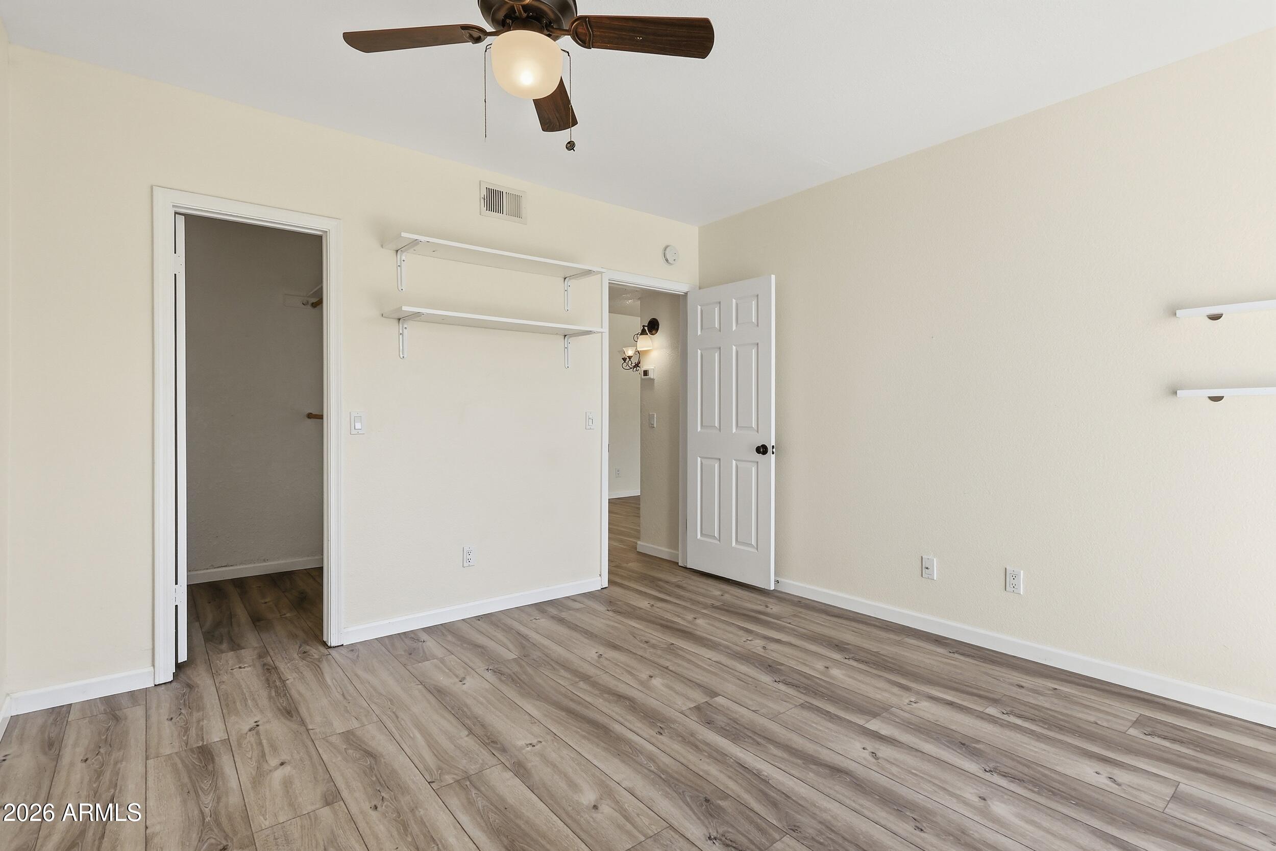1825 West Ray Road, Unit 1018 Chandler, AZ 85224 - Photo 12 of 46 wooden floor in an empty room