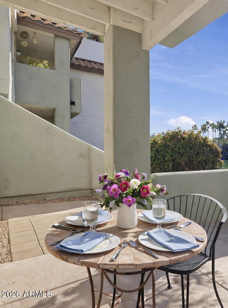 1825 West Ray Road, Unit 1018 Chandler, AZ 85224 - Photo 15 of 46 a dining room with furniture and wooden floor