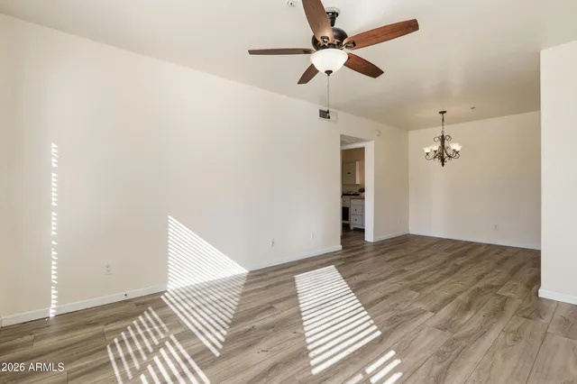a view of a garden with a building in the background