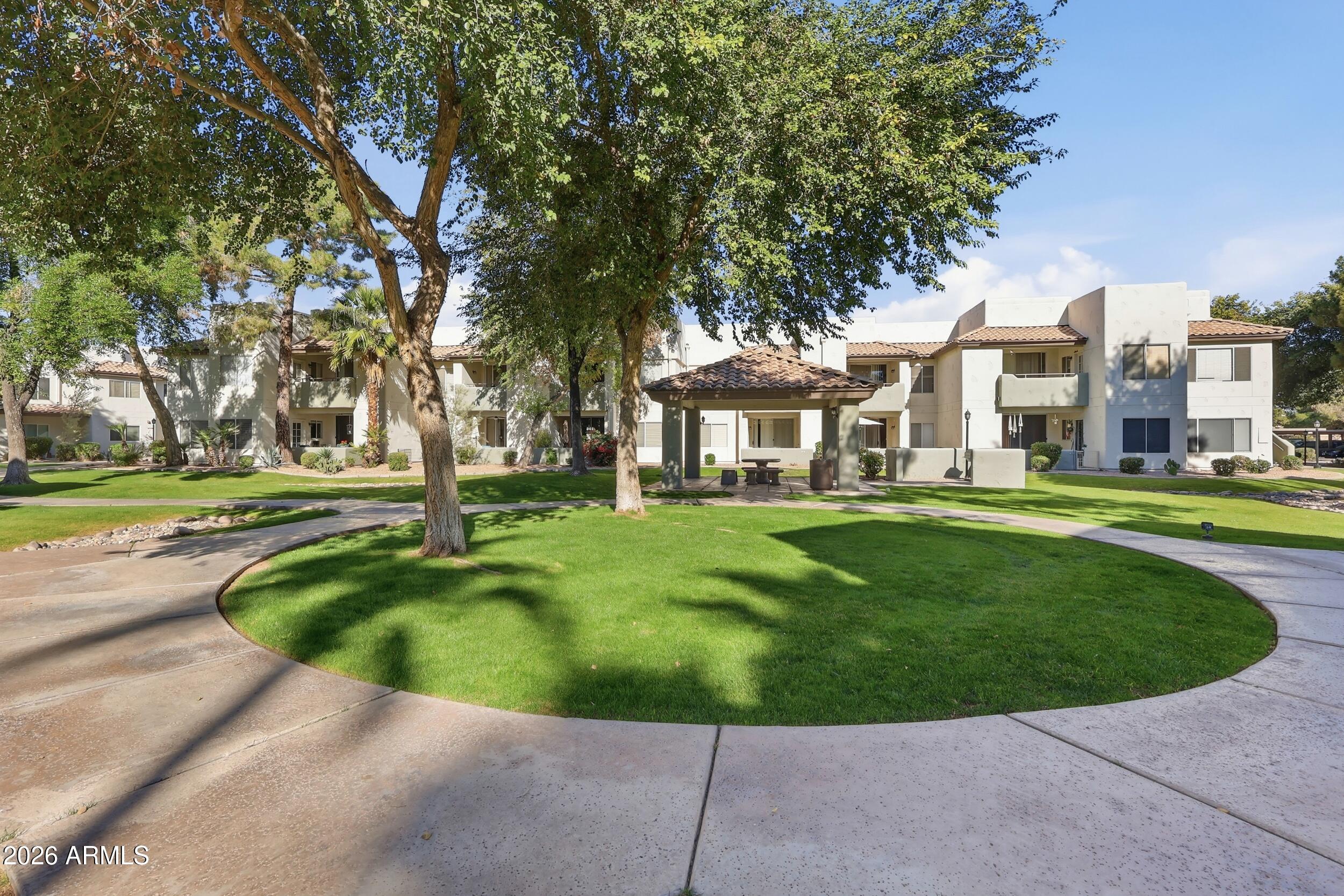 1825 West Ray Road, Unit 1018 Chandler, AZ 85224 - Photo 33 of 46 a view of a house with a swimming pool