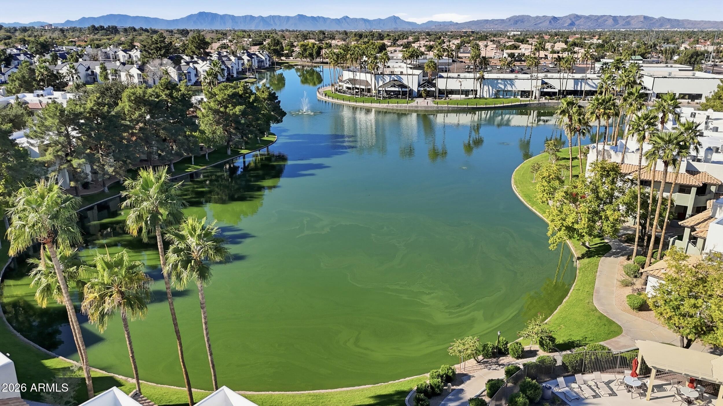 1825 West Ray Road, Unit 1018 Chandler, AZ 85224 - Photo 36 of 46 a view of a lake with a mountain