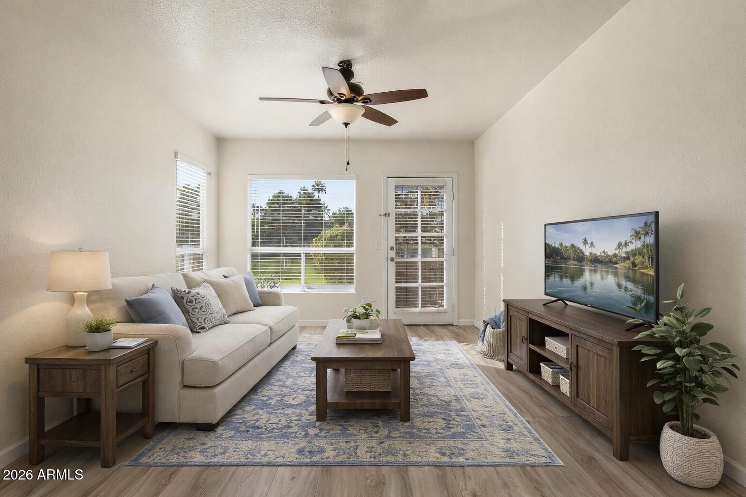 1825 West Ray Road, Unit 1018 Chandler, AZ 85224 - Photo 3 of 46 a living room with furniture and a fireplace