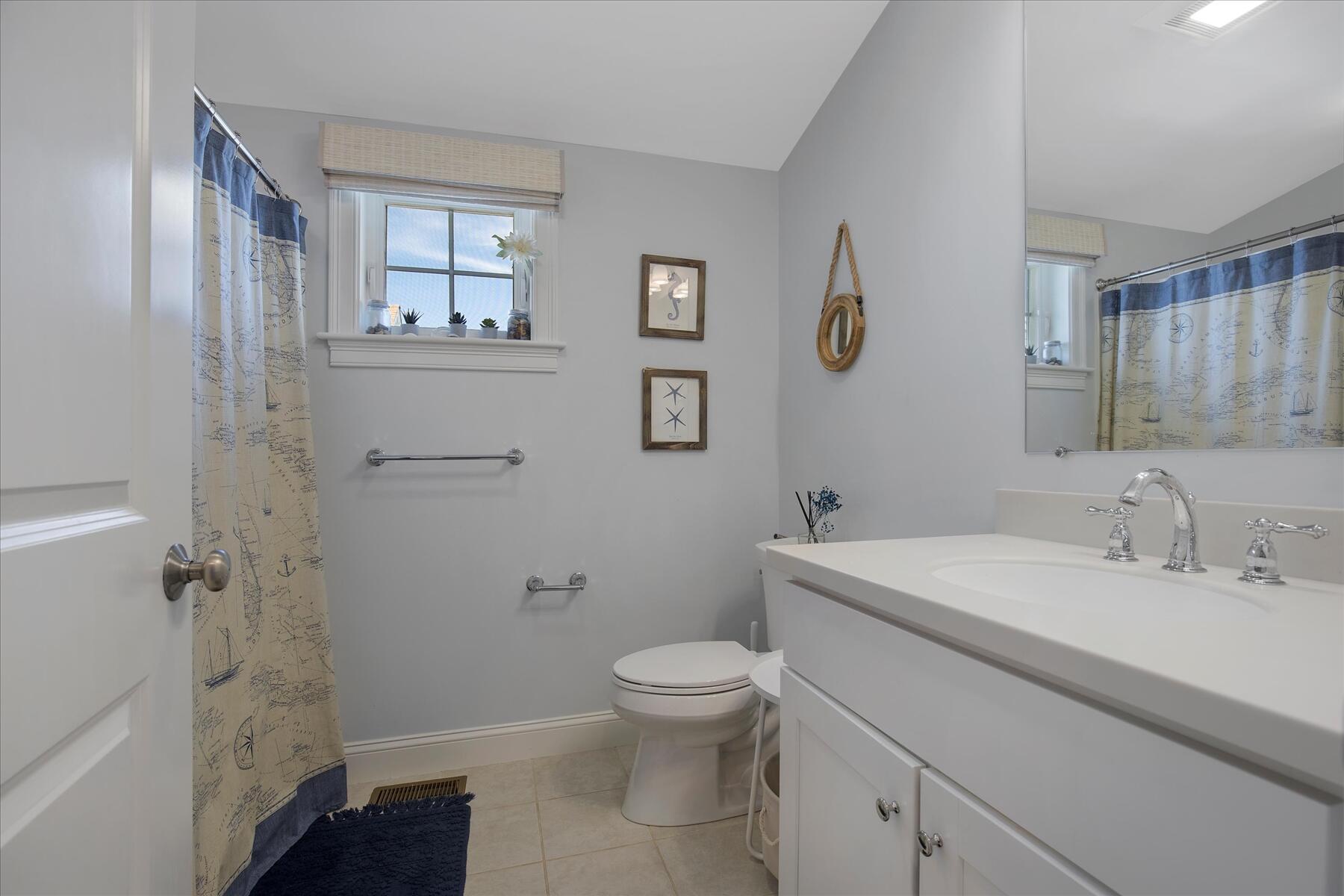 21 Saltwater Circle Mashpee, MA 02649 - Photo 19 of 40 a bathroom with a sink a toilet and shower