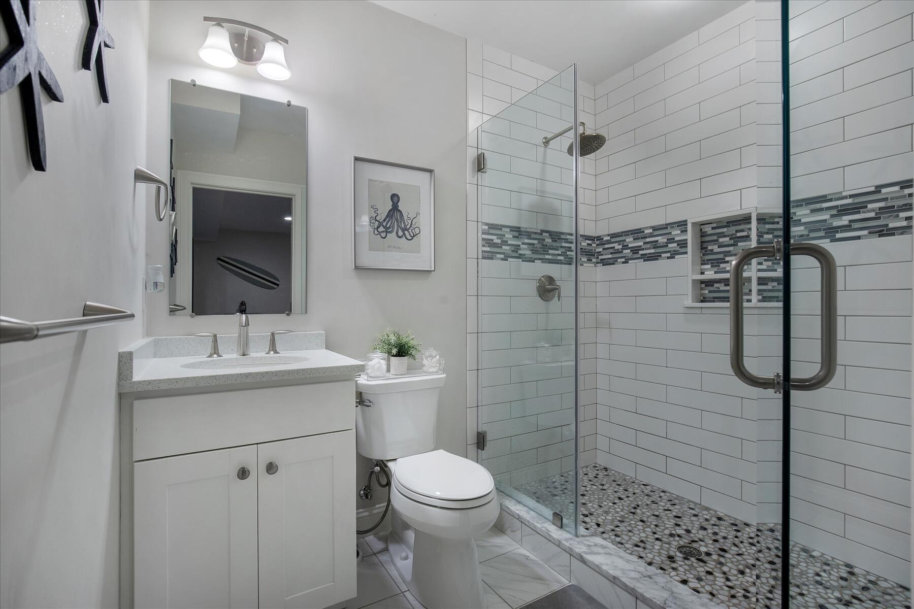 21 Saltwater Circle Mashpee, MA 02649 - Photo 24 of 40 a bathroom with a toilet sink and shower