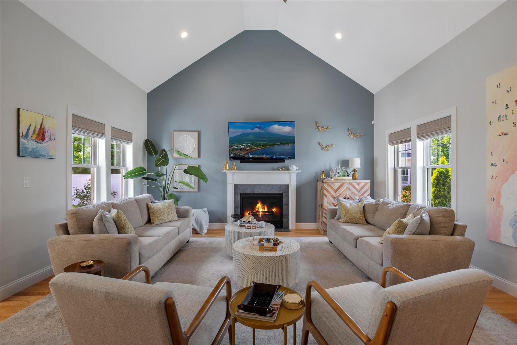 21 Saltwater Circle Mashpee, MA 02649 - Photo 5 of 40 a living room with furniture a fireplace and a flat screen tv