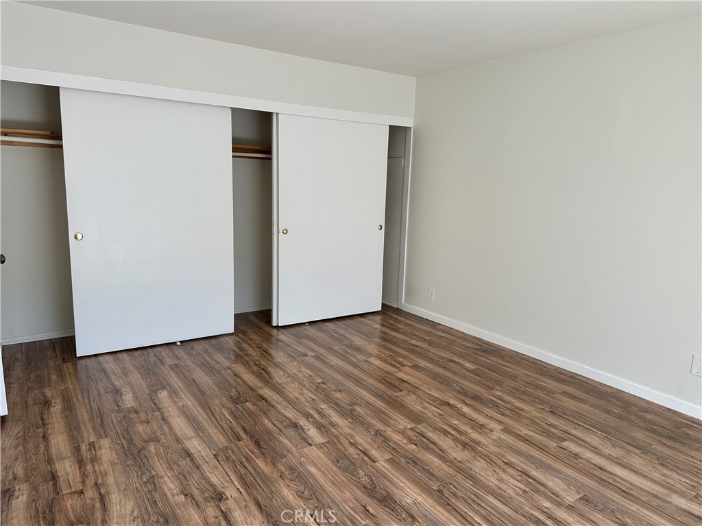1 Sunflower Irvine, CA 92604 - Photo 11 of 19 a view of an empty room with wooden floor and a window
