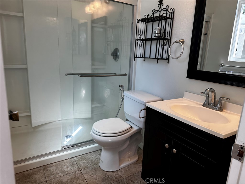 1 Sunflower Irvine, CA 92604 - Photo 12 of 19 a bathroom with a sink toilet and shower