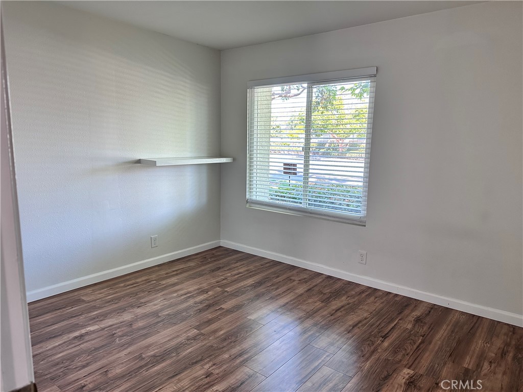 1 Sunflower Irvine, CA 92604 - Photo 14 of 19 an empty room with wooden floor and windows
