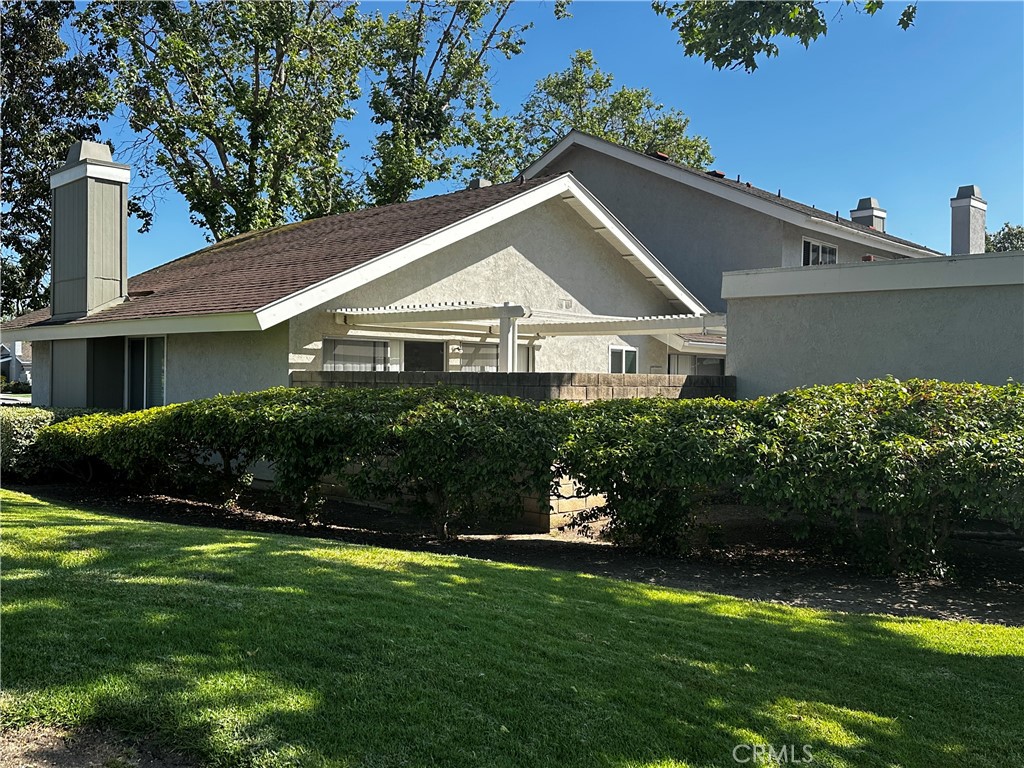 1 Sunflower Irvine, CA 92604 - Photo 3 of 19 a front view of a house with a yard