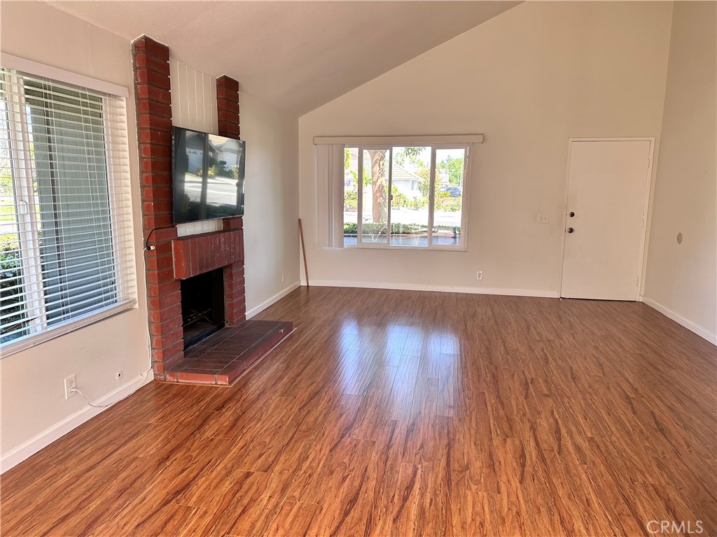 1 Sunflower Irvine, CA 92604 - Photo 6 of 19 an empty room with wooden floor and windows