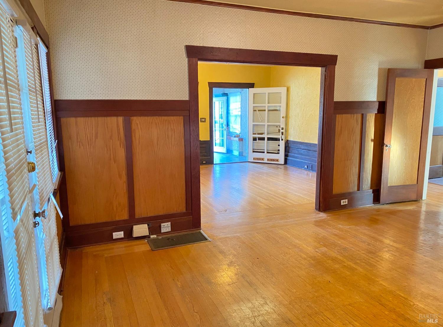745 Jackson Street Fairfield, CA 94533 - Photo 35 of 72 a view of an empty room with a fireplace and a mirror