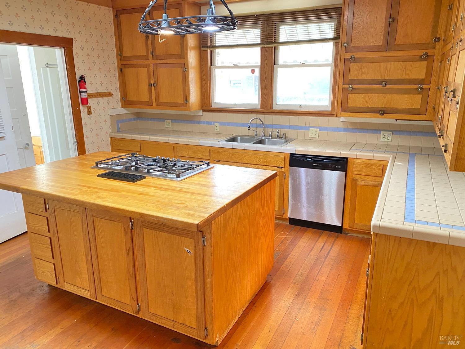 745 Jackson Street Fairfield, CA 94533 - Photo 40 of 72 a kitchen with a sink stove and cabinets