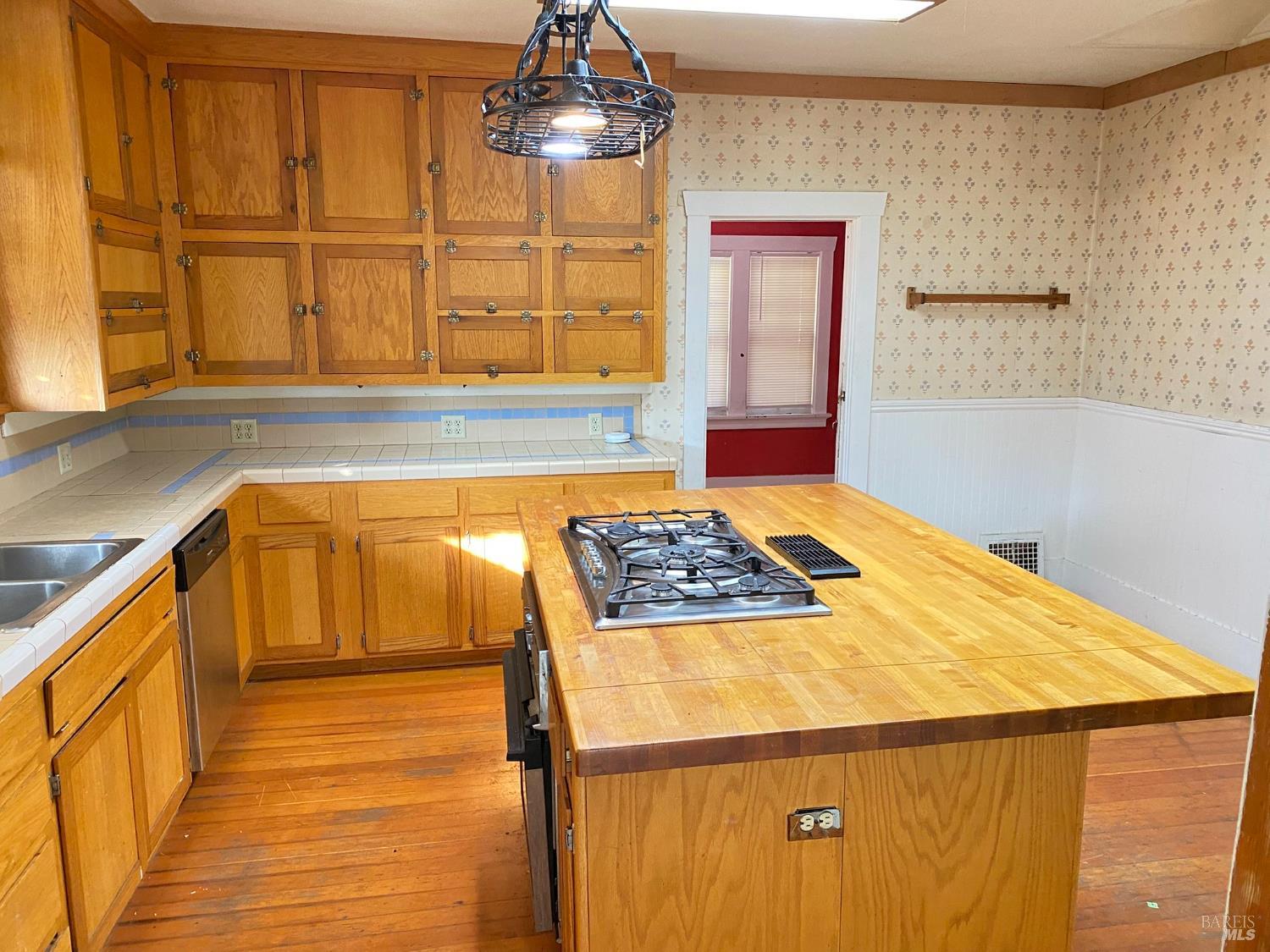 745 Jackson Street Fairfield, CA 94533 - Photo 43 of 72 a kitchen with a stove and a refrigerator