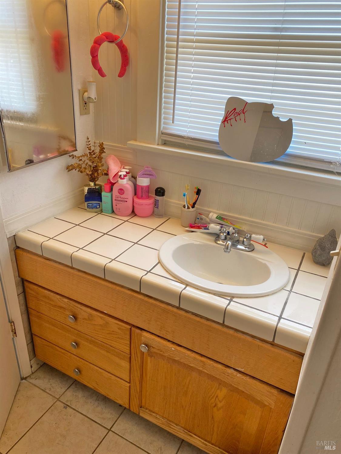 745 Jackson Street Fairfield, CA 94533 - Photo 59 of 72 a bathroom with a sink and a mirror