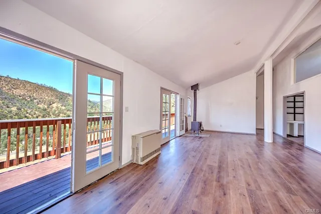 a kitchen with granite countertop a sink and a stove
