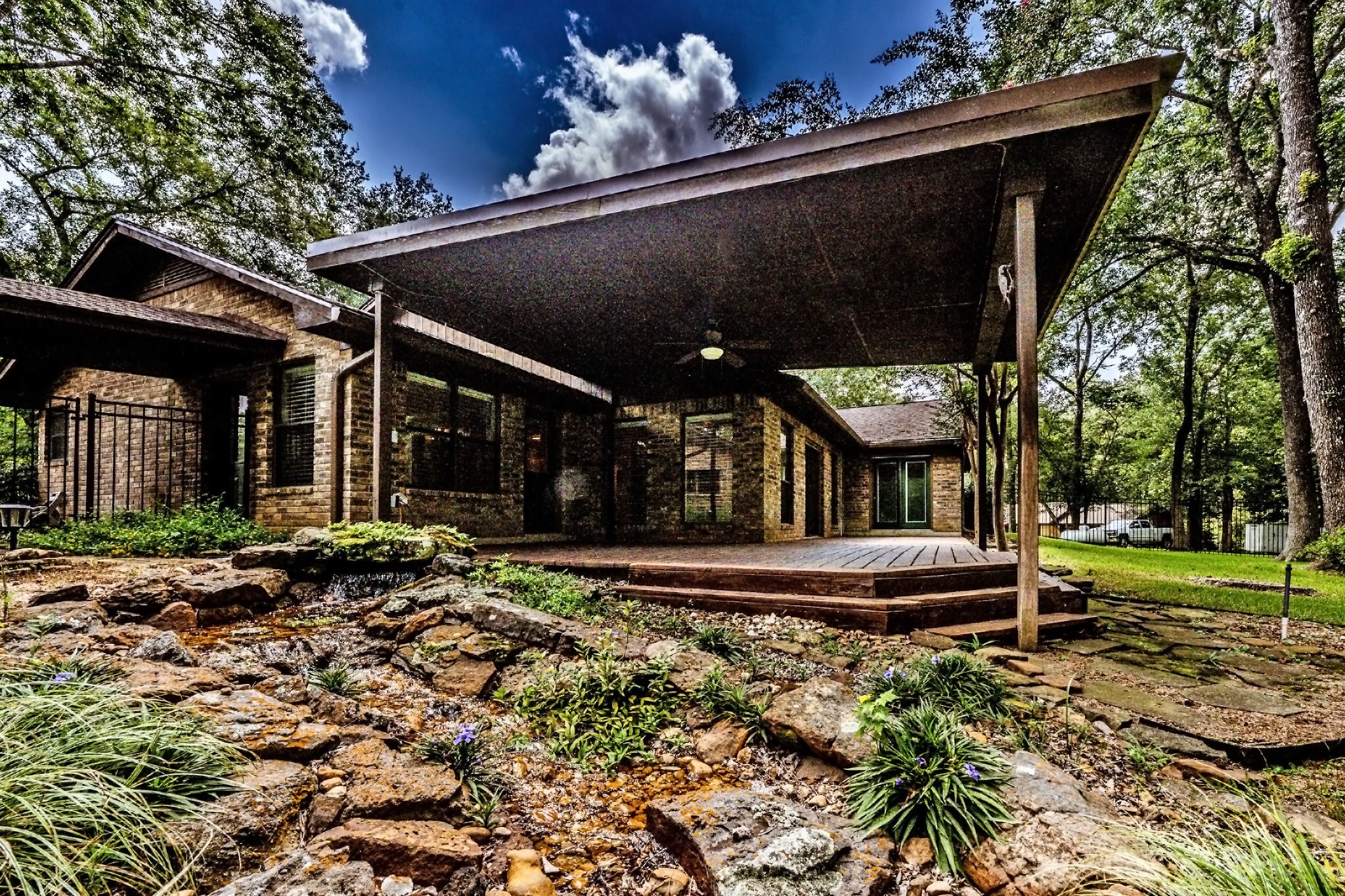 104 Oakview Circle Huntsville, TX 77340 - Photo 2 of 36 a front view of a house with a yard