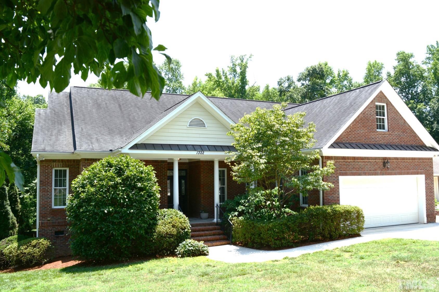 1322 Medfield Road Raleigh, NC 27607 - Photo 11 of 25 a front view of a house with a yard