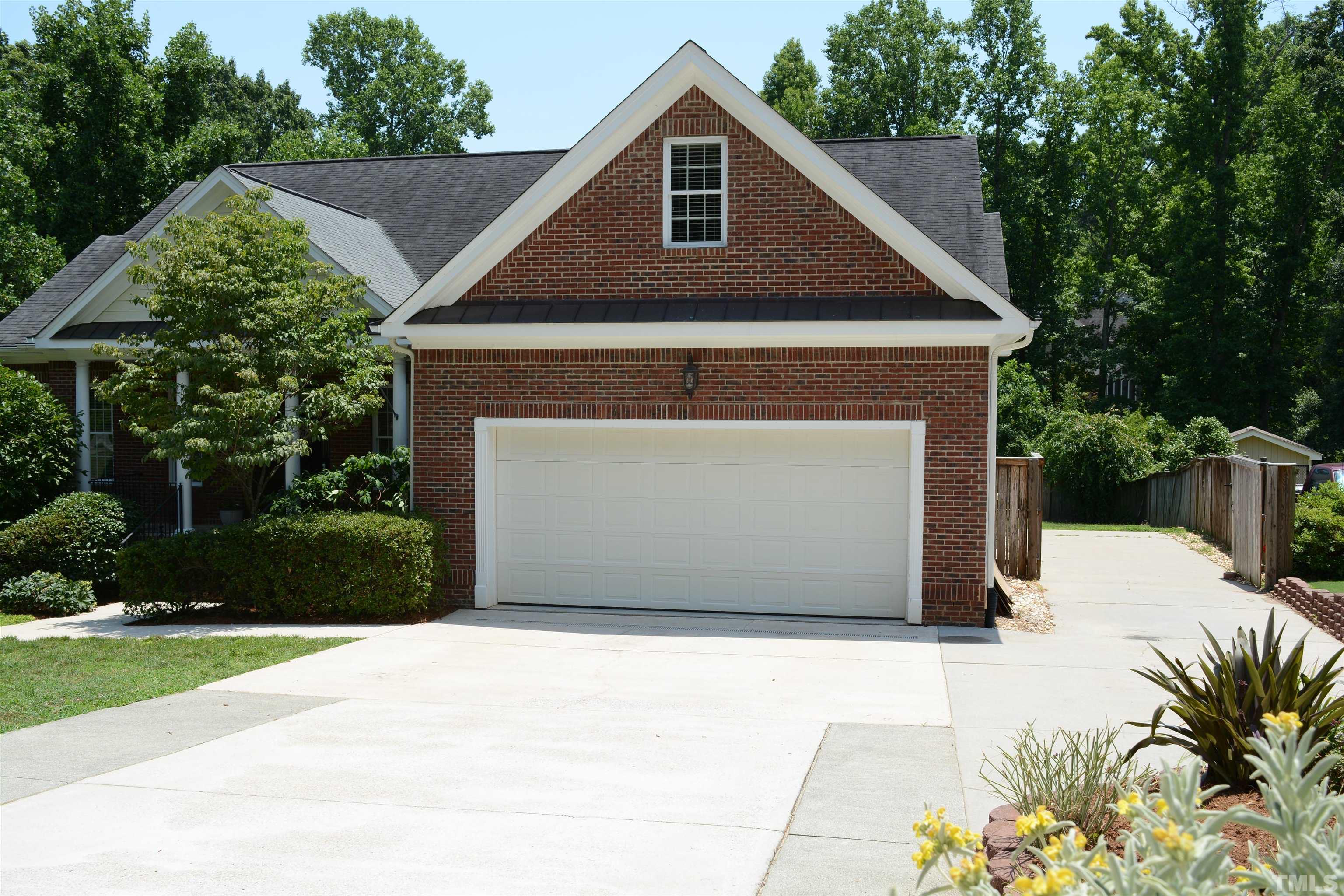 1322 Medfield Road Raleigh, NC 27607 - Photo 3 of 25 a front view of a house with a yard and garage