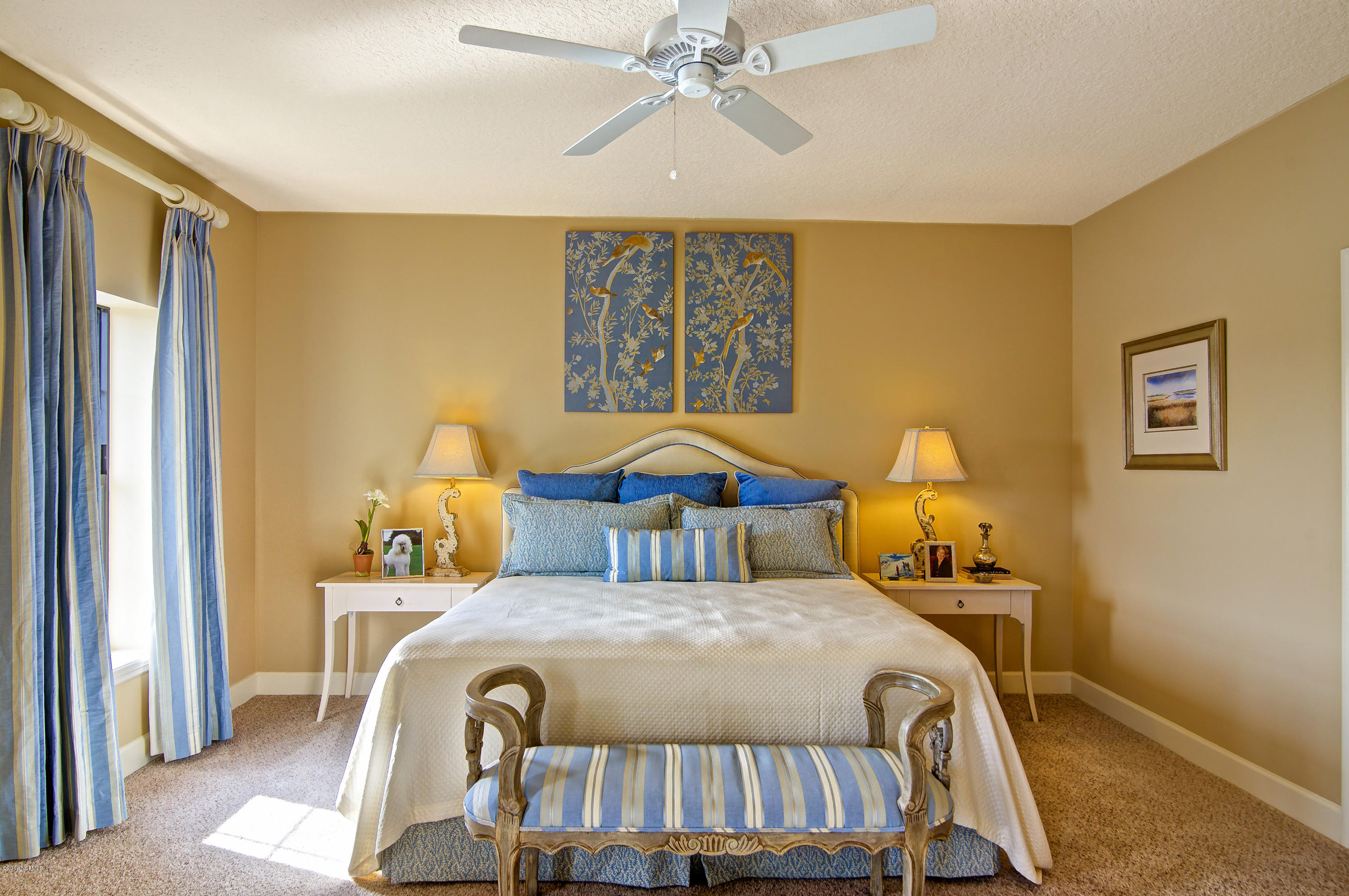 3958 Baymeadows Road, Unit 4402 Jacksonville, FL 32217 - Photo 11 of 14 a bedroom with a bed and wooden floor