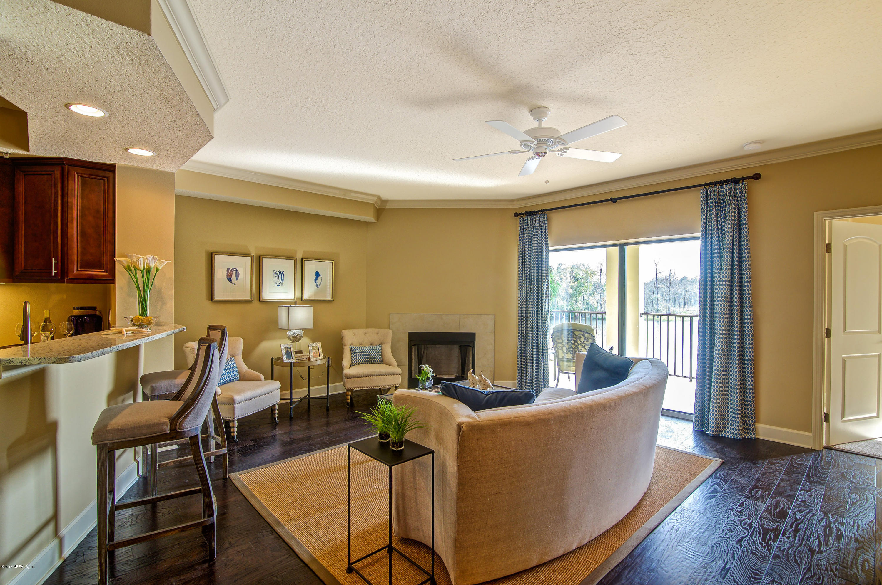3958 Baymeadows Road, Unit 4402 Jacksonville, FL 32217 - Photo 4 of 14 a living room with fireplace furniture and a window