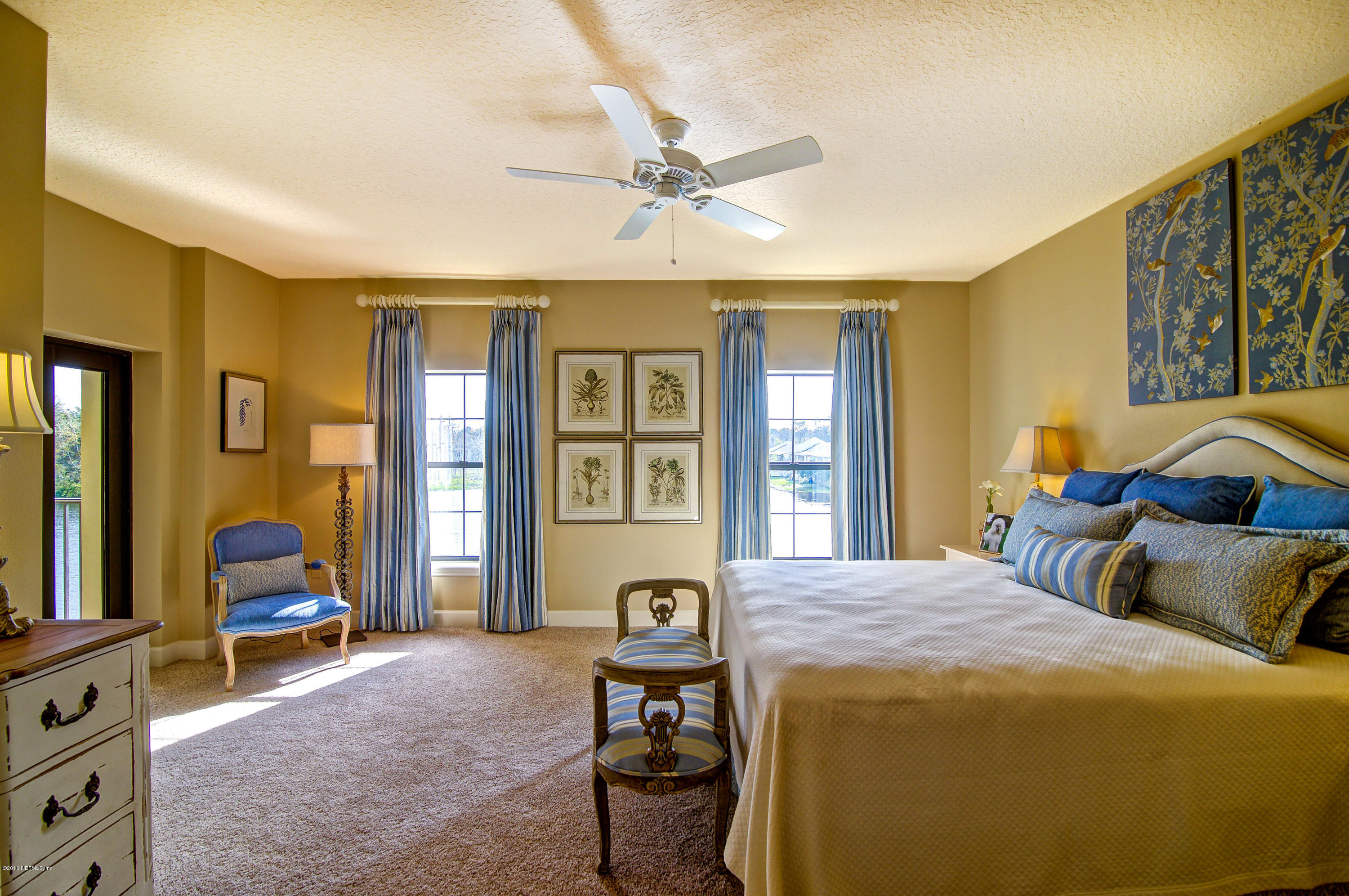3958 Baymeadows Road, Unit 4402 Jacksonville, FL 32217 - Photo 10 of 14 a bedroom with a bed and wooden floor