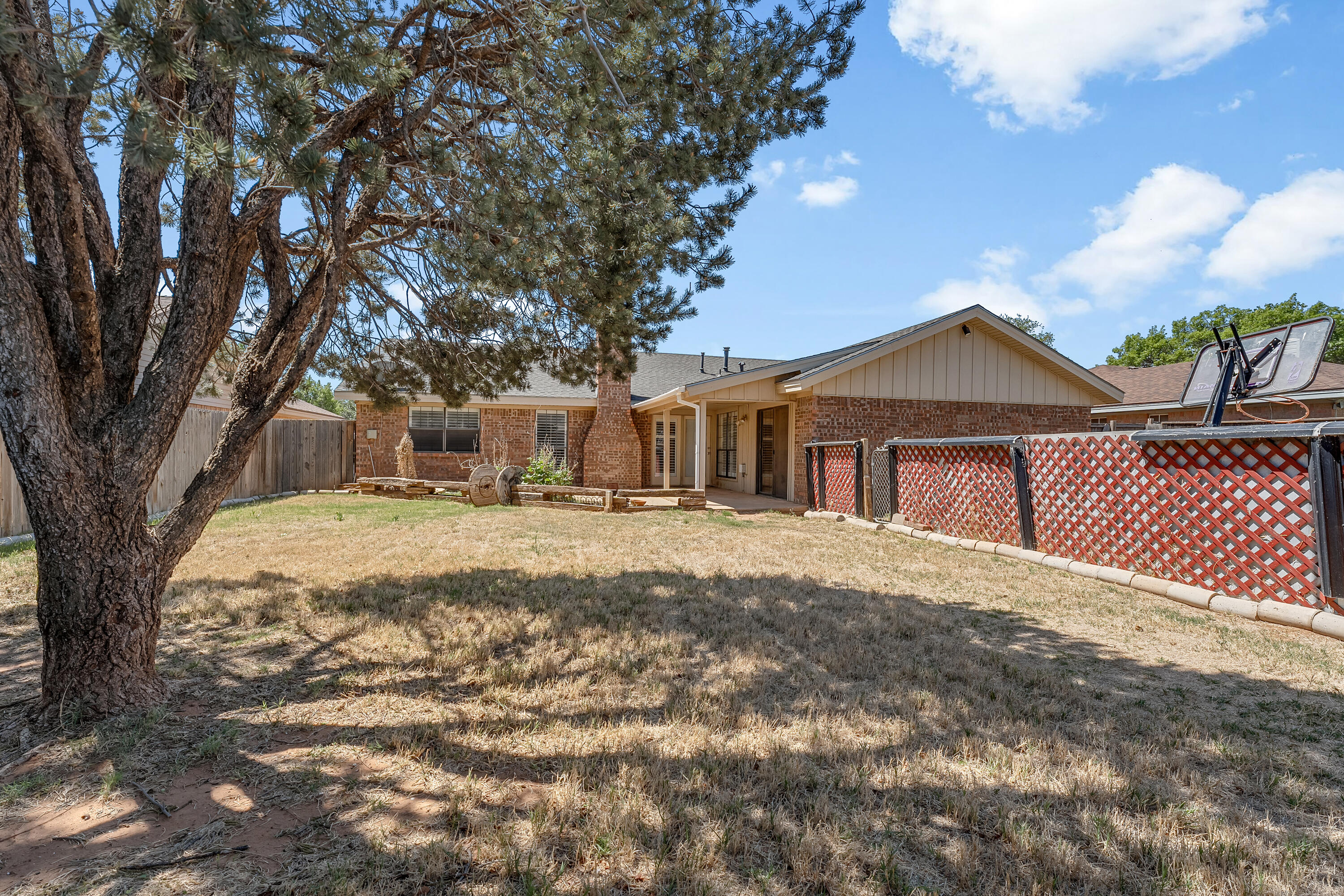 5236 91st Street Lubbock, TX 79424 - Photo 21 of 23 a front view of a house with a yard