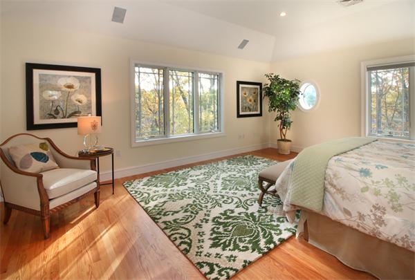 79 Winter Street Lincoln, MA 01773 - Photo 16 of 30 a bed sitting in a bedroom next to a window