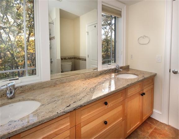 79 Winter Street Lincoln, MA 01773 - Photo 19 of 30 a bathroom with a granite countertop sink and a mirror