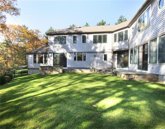 79 Winter Street Lincoln, MA 01773 - Photo 30 of 30 a front view of a house with a yard table and chairs