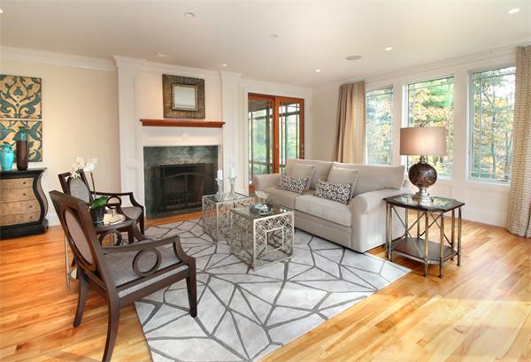 79 Winter Street Lincoln, MA 01773 - Photo 5 of 30 a living room with furniture a dining table and a fireplace