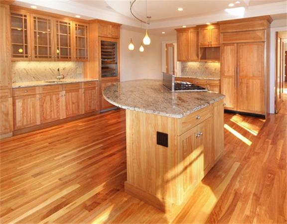 79 Winter Street Lincoln, MA 01773 - Photo 9 of 30 a kitchen with stainless steel appliances granite countertop a stove and cabinets