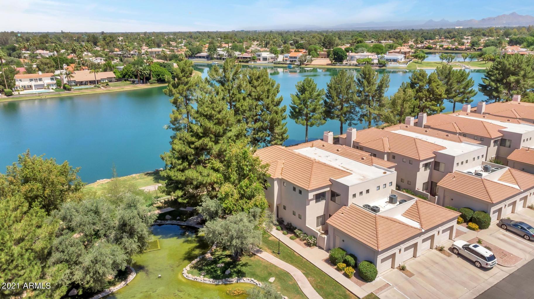 an aerial view of a house with a lake view