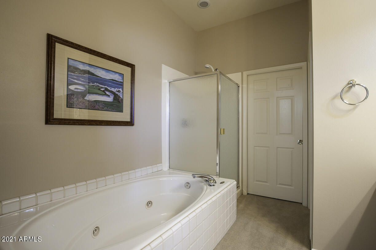8270 North Hayden Road, Unit 2019 Scottsdale, AZ 85258 - Photo 20 of 39 a bathroom with a bathtub and a shower