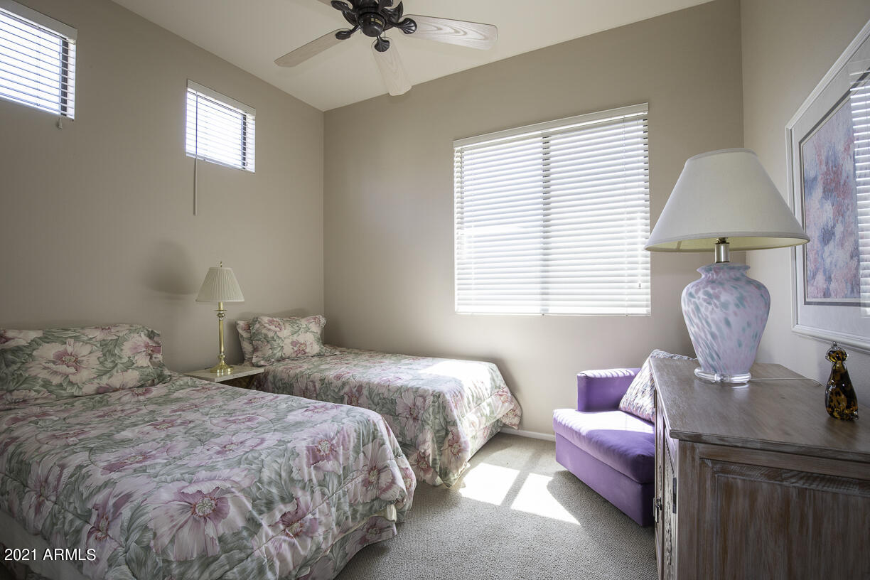 8270 North Hayden Road, Unit 2019 Scottsdale, AZ 85258 - Photo 21 of 39 a bedroom with a bed and a window