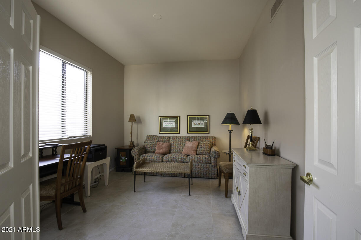 8270 North Hayden Road, Unit 2019 Scottsdale, AZ 85258 - Photo 22 of 39 a living room with furniture and a window