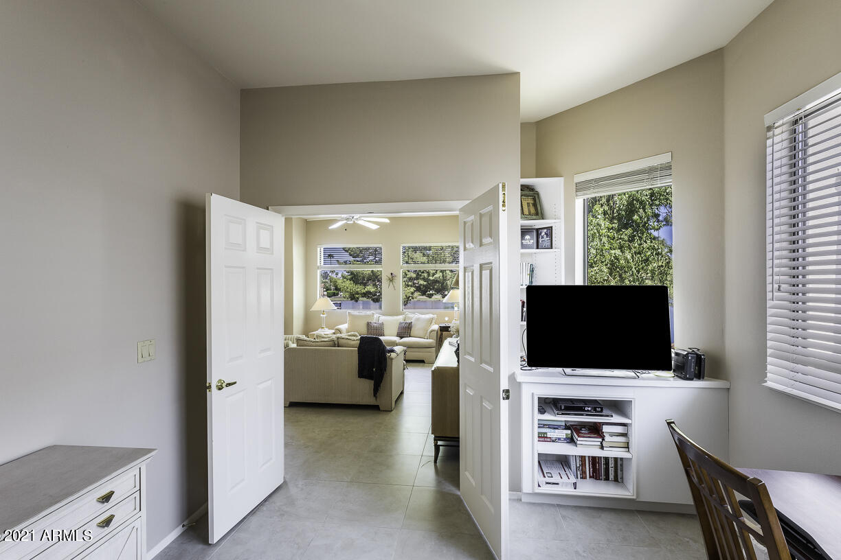 8270 North Hayden Road, Unit 2019 Scottsdale, AZ 85258 - Photo 23 of 39 a living room with furniture and flat screen tv