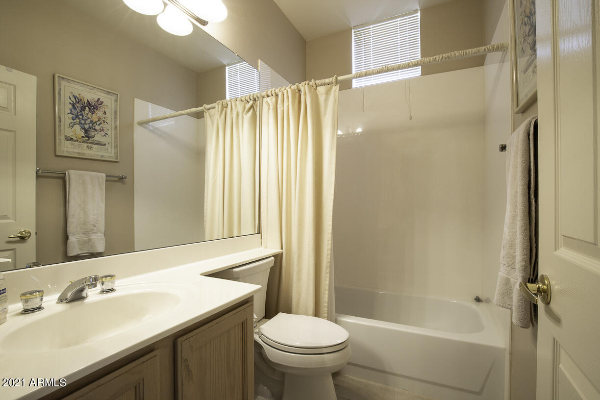 8270 North Hayden Road, Unit 2019 Scottsdale, AZ 85258 - Photo 24 of 39 a bathroom with a sink toilet and shower