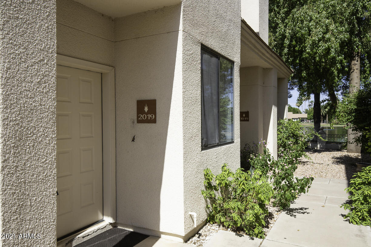 8270 North Hayden Road, Unit 2019 Scottsdale, AZ 85258 - Photo 26 of 39 a couple of potted plants in front of door