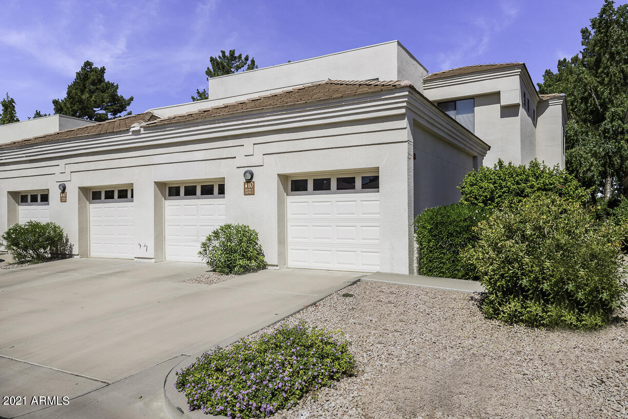 8270 North Hayden Road, Unit 2019 Scottsdale, AZ 85258 - Photo 27 of 39 front view of a house with a yard