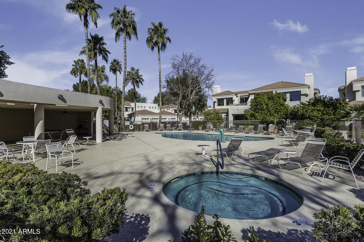 8270 North Hayden Road, Unit 2019 Scottsdale, AZ 85258 - Photo 29 of 39 a swimming pool with outdoor seating yard and plants